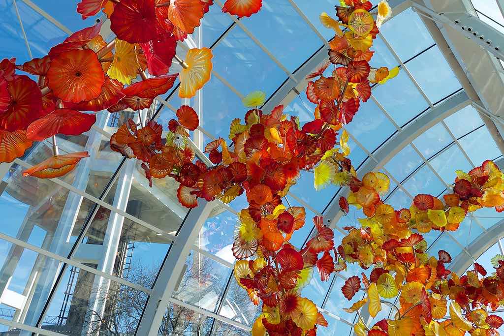 Explore an array of vibrant glass gardens at Chihuly Garden and Glass. Credit: Frank Fujimoto
