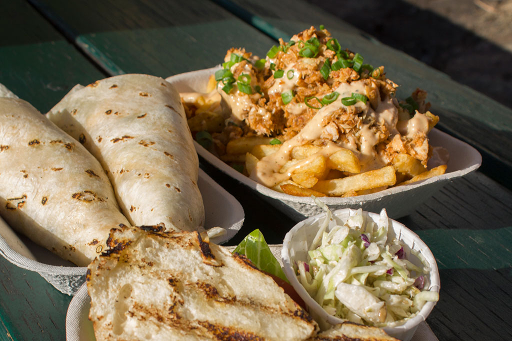 Nosh on everything from delicious fish tacones to jerk fish poutine. Credit: Quinn Dombrowski