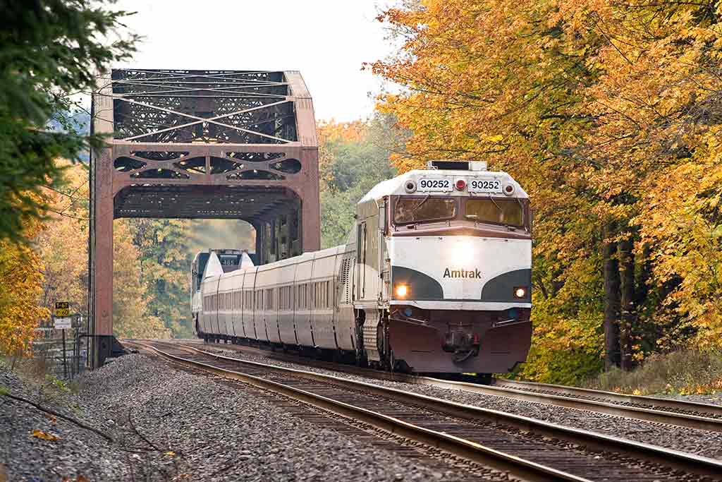 Wind your way past forests and rivers on the way to Vancouver. Credit: Amtrak Cascades