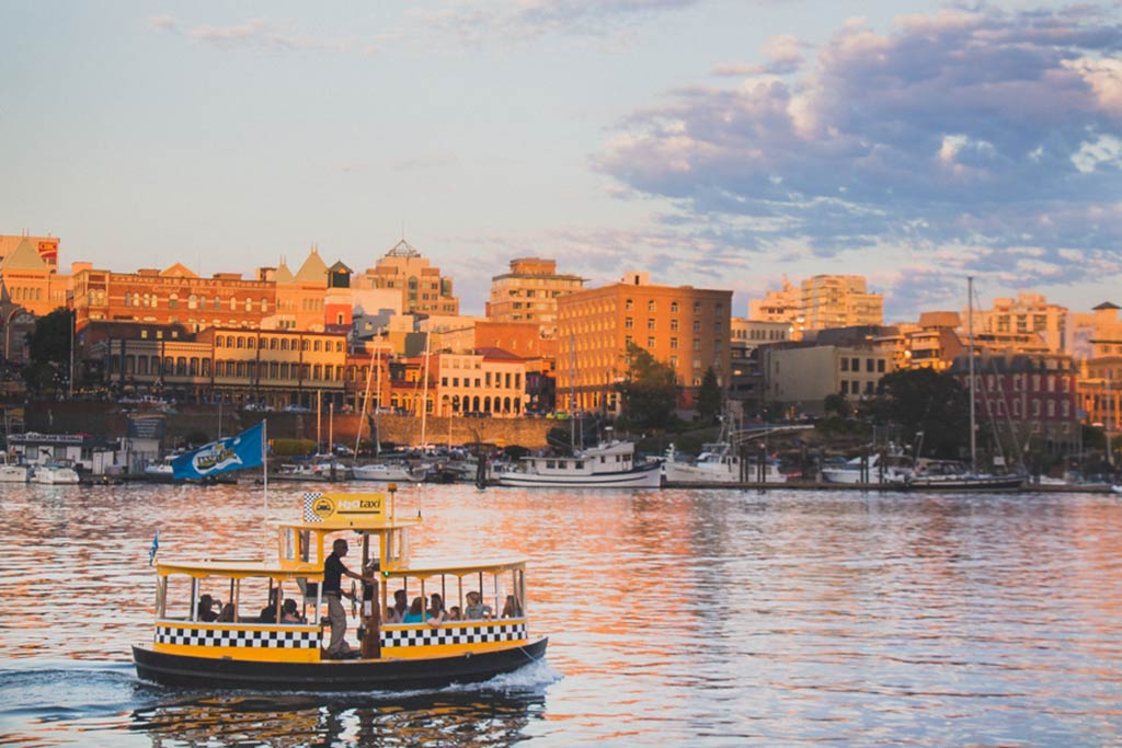 Watch boats sail in and out of the Inner Harbour from aboard a cheerful Harbour Ferry! Credit: Scott Rose