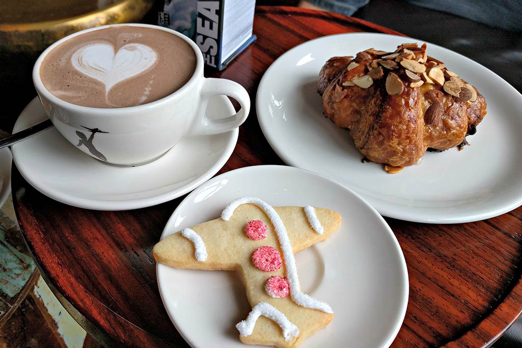 Baked goodies and warm mugs are in no short supply at Pike Place Market’s Storyville Coffee. Credit: Flickr/ruthanddave
