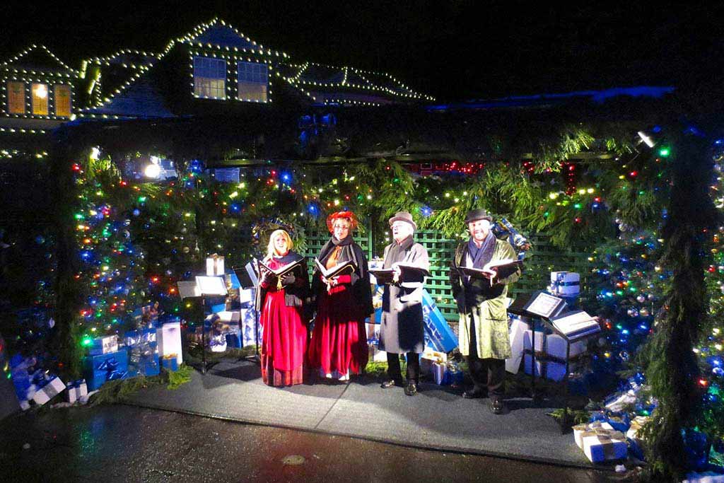Listen to carolers among the trees at The Butchart Gardens. Credit: Brenna Ciummo