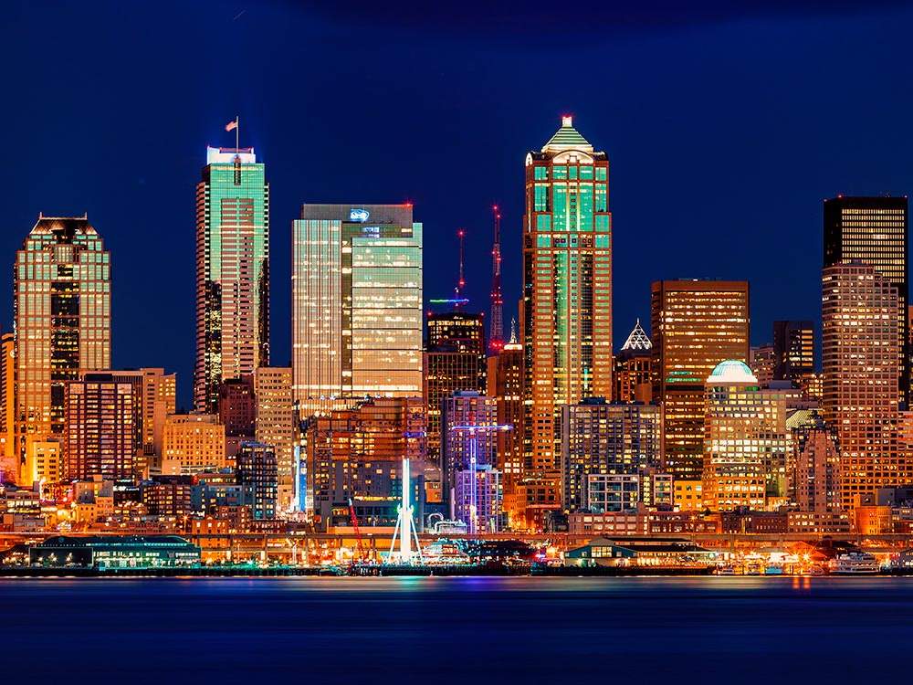 Seattle's waterfront illuminated with lights.