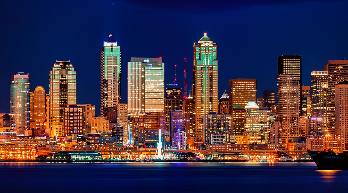 Seattle's waterfront illuminated with lights.