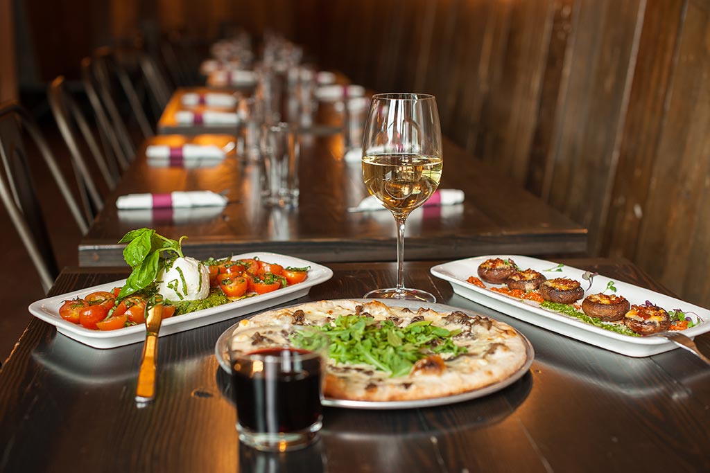 Everything from wood-fired pizzas to chorizo and sharp white cheddar stuffed mushrooms await you at Sulla Vita. Photo: Dzhan Wiley