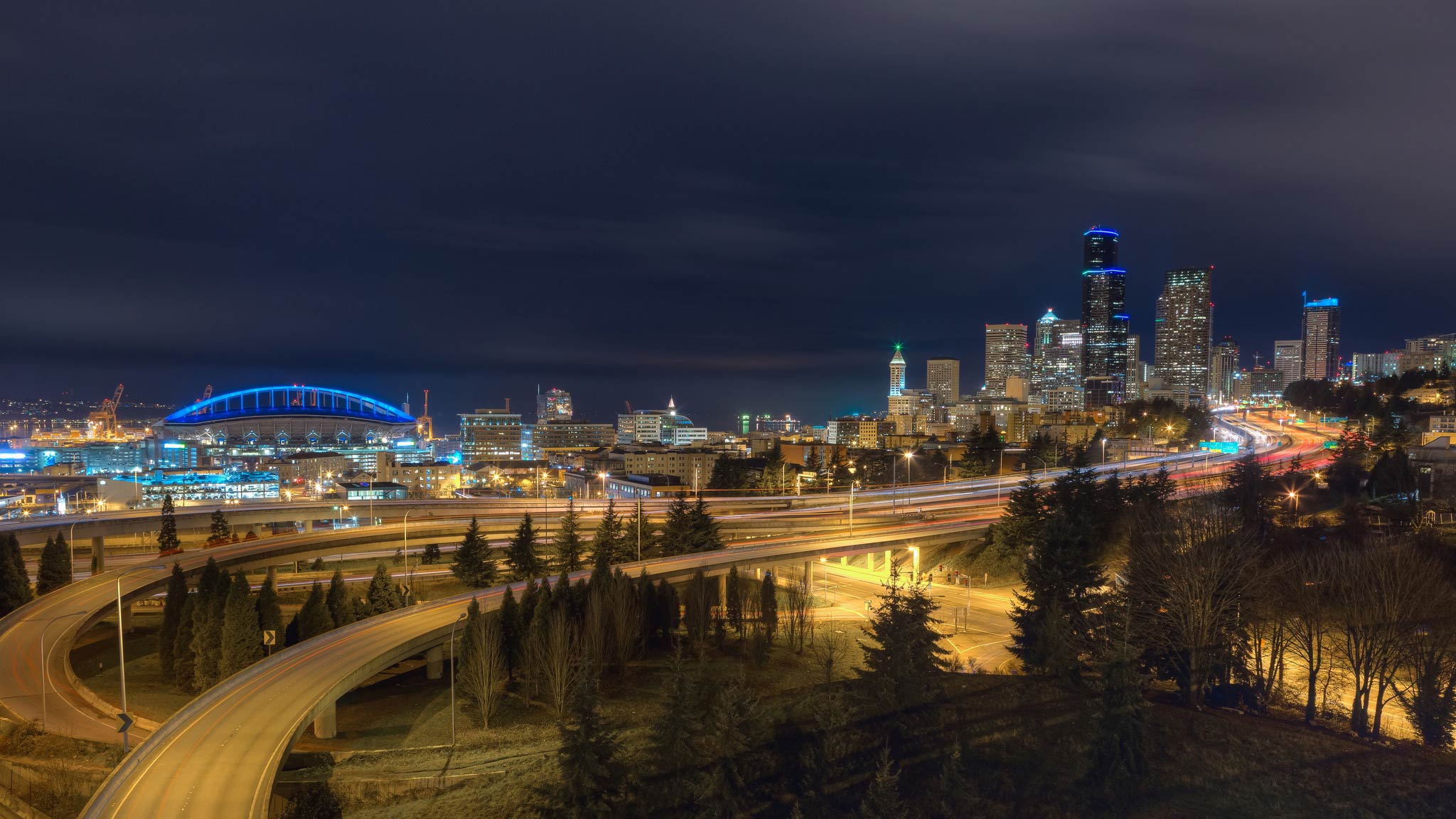 Blue lights illuminate CenturyLink Field and downtown Seattle in honor of the Seahawks game.