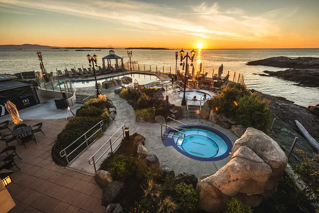 Rejuvenate with a soak in a steaming hot seaside mineral pool. Credit: Oak Bay Beach Hotel