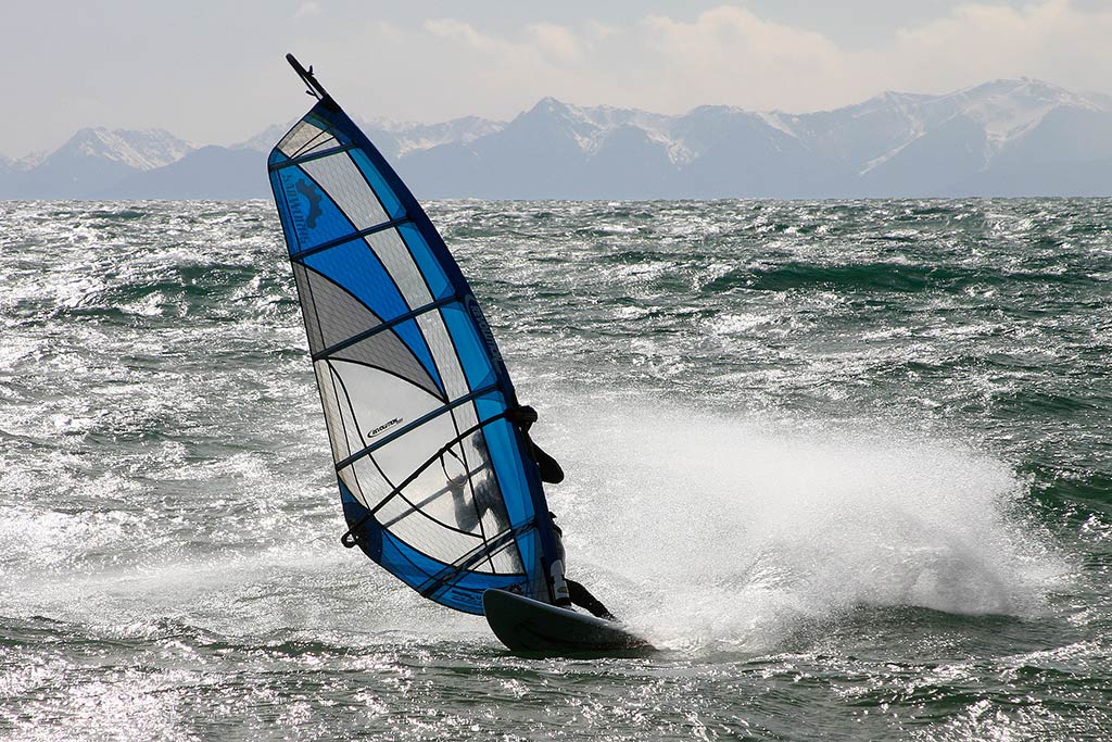 A steady supply of mountain views and whipping winds make Clover Point a prime spot for windsurfing. Credit: Tourism Victoria
