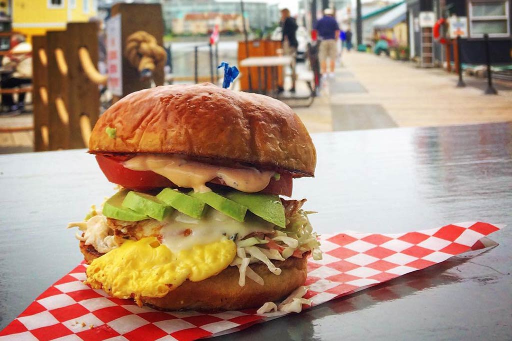 Nosh on one of Smoke and Anchor's massive burgers as you wander the docks. Credit: @smokeandanchor
