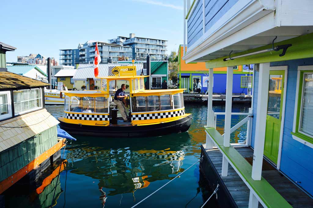 Hop on one of Victoria’s cute Harbour Ferries and zip across the Inner Harbour. Credit: Scott Meis