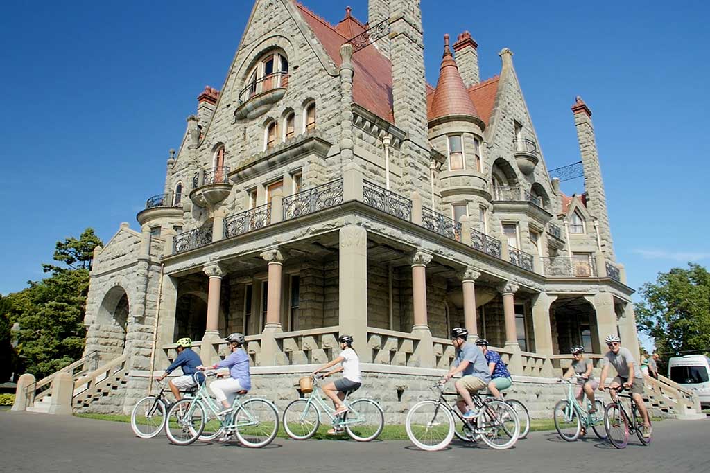 Cruise past the stunning Craigdarroch Castle. Credit: The Pedaler Bicycle Tours