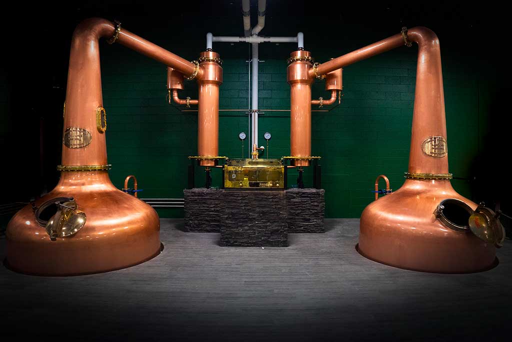 Massive copper stills fill the Victoria Distillery. Credit: West Coast Brewery Tours