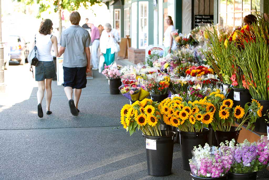 Stroll through Oak Bay Village to pick up colorful flowers, snacks and more! Credit: Tourism Victoria