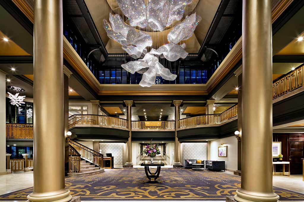 Keep your head pointed skyward to catch the playful cloud-like chandelier in the Empress’ lobby. Credit: Fairmont Empress