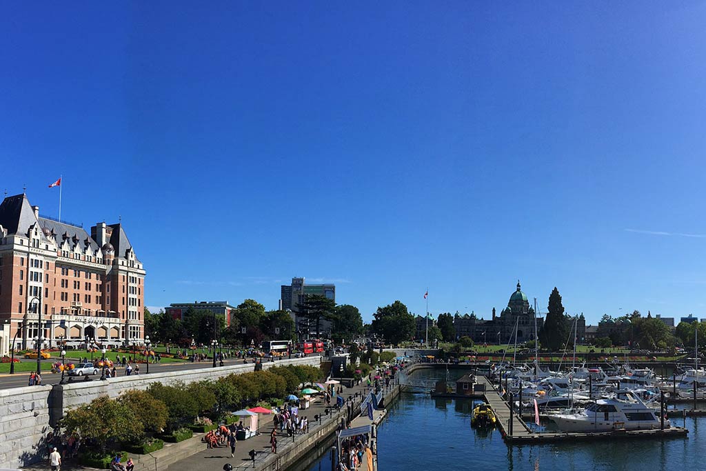 Drink in the picturesque views of the boats bobbing in Victoria’s Inner Harbour. Credit: Scott Meis