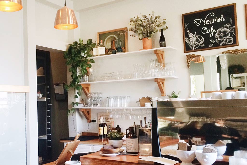 Coffee cups wait to be filled with delicious brews in this sunlit cafe. Credit: Scott Meis