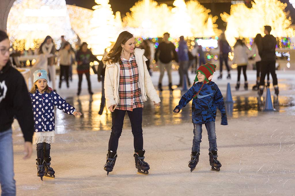 Take the kiddos for a lap or two around Enchant's magical ice skating trail. Credit: Enchant Christmas Seattle