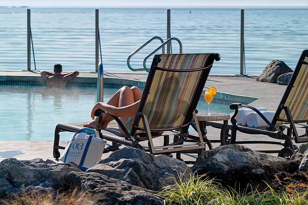 Relax poolside with your besties. Credit: Oak Bay Beach Hotel