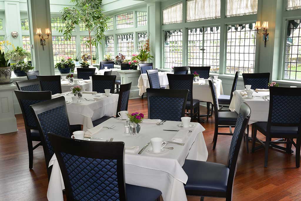 Feast on tasty eats while being surrounded by a variety of gorgeous blooms in the Dining Room Restuarant. Credit: The Butchart Gardens