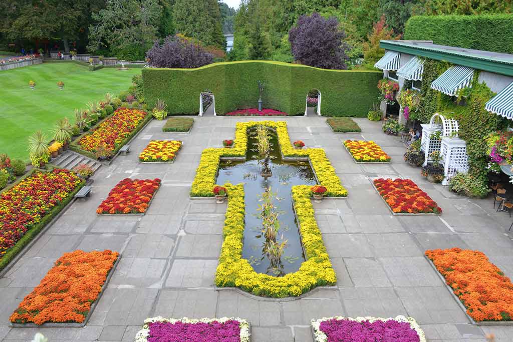 Bronze statues and the nearby Gelateria Benvenuto bring a taste of Italy to the grounds. Credit: The Butchart Gardens