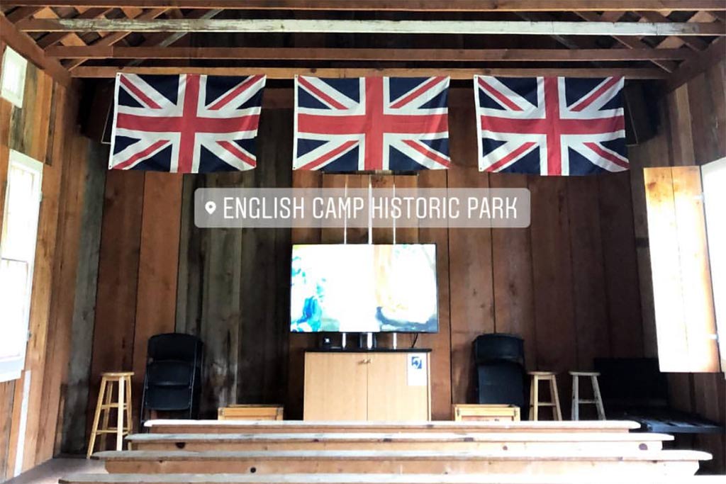 Explore the barracks under old fruit trees at the picturesque English Camp. Credit: The Arbos