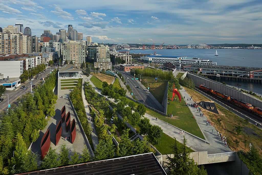 The open-air Olympic Sculpture Park features modern art and breathtaking vistas of the waterfront and Seattle skyline. Credit: Benjamin Benschneider
