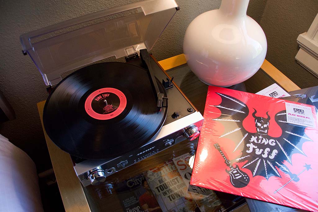 Broaden your horizons with art-filled floors and curated collections of vinyl. Credit: Hotel Max