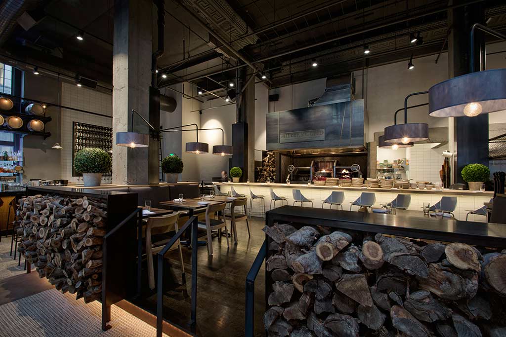 Cozy up in the rustic Miller's Guild for a phenomenal eats. Credit: Hotel Max