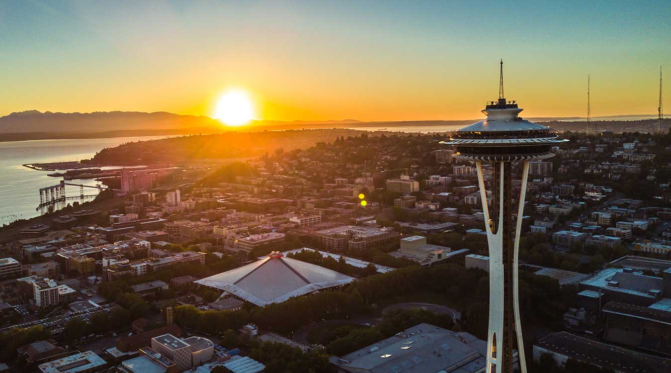 The sun sets on downtown Seattle, WA.