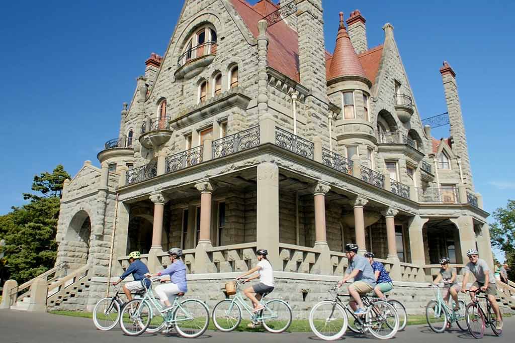 Cruise past the stunning Craigdarroch Castle. Credit: The Pedaler Bicycle Tours