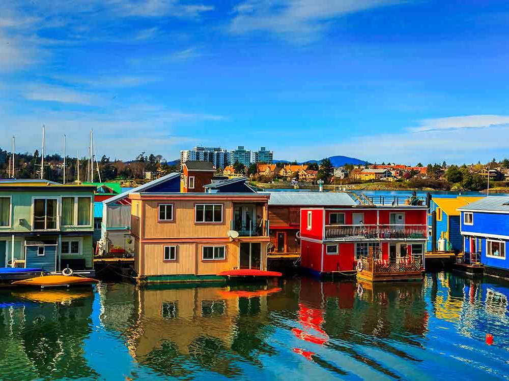 Colorful houseboats line the docks of Fisherman's Wharf in Victoria, BC.