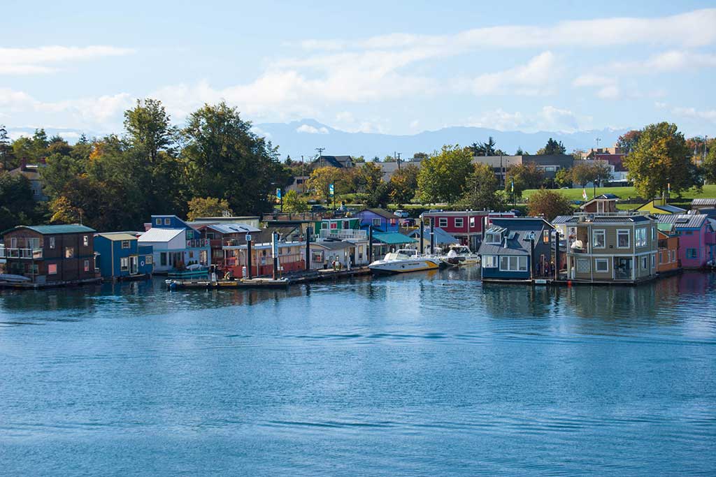 Wander through a colorful collection of floating houseboats along Fisherman’s Wharf. Credit: Destination Greater Victoria