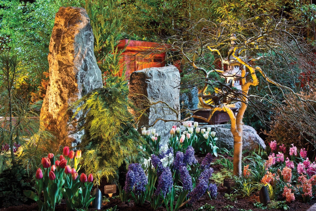Craggy boulders offer a rustic vibe in a flower-filled woodland display. Photo: Northwest Flower & Garden Show