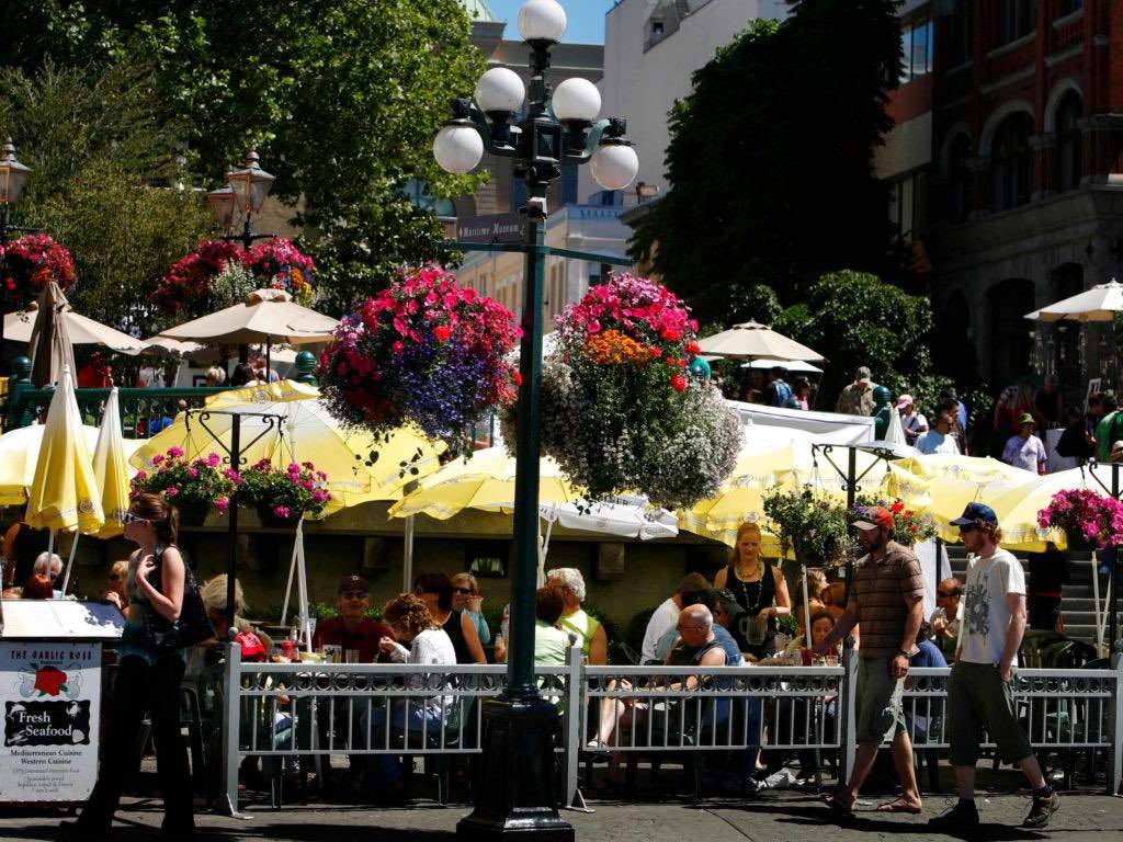 Colorful flower baskets line Victoria's Bastion Square.