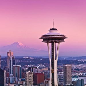 A sherbet-colored sunset fills the Seattle sky.