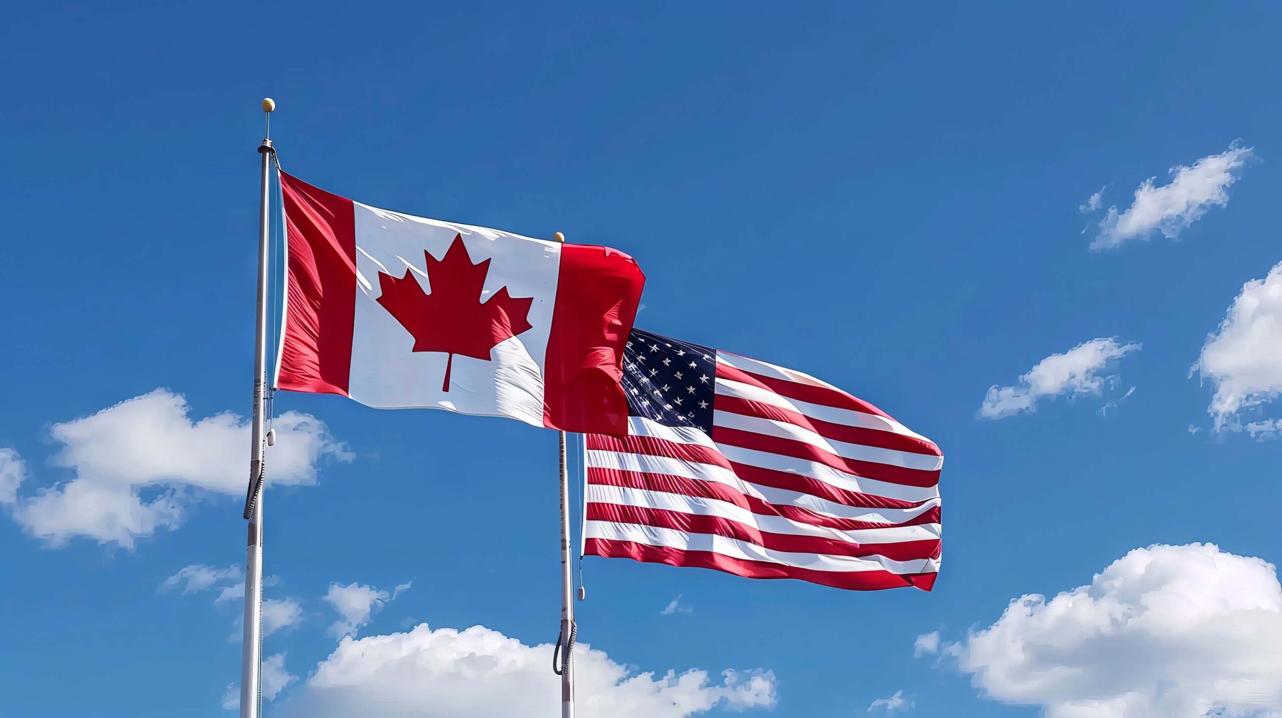 Photo of Canadian and American flags